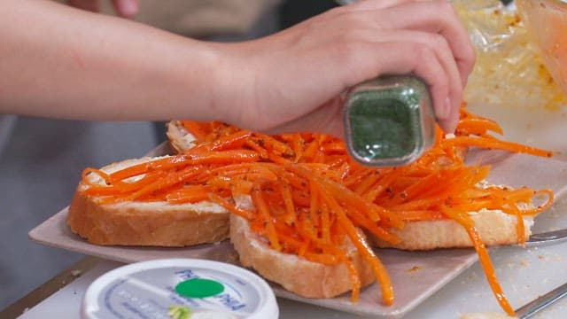 Parsley Sprinkled on Baguette Topped with Carrots