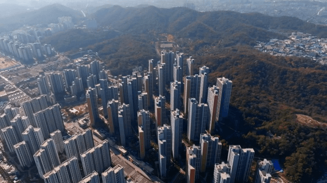 High-rise apartments surrounded by mountains