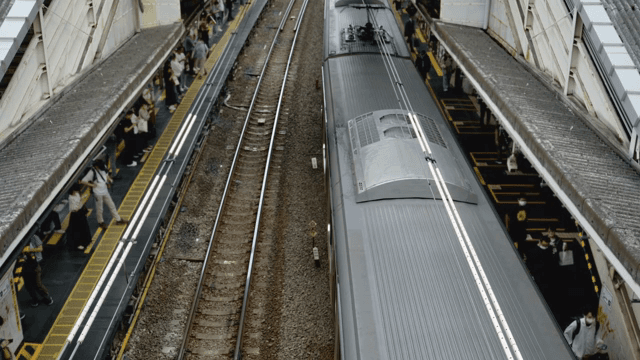 Train arriving at a busy station platform