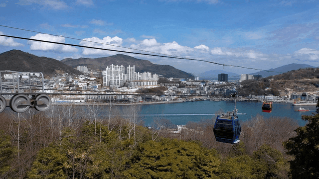 Cable cars overlooking a coastal city