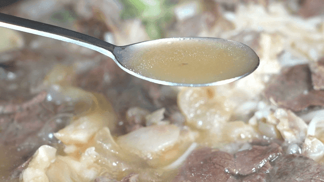 Spoon to scoop up rich broth of boiled pork