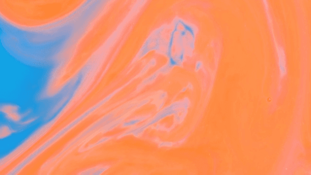 Abstract pattern of blue and orange liquids mixing together