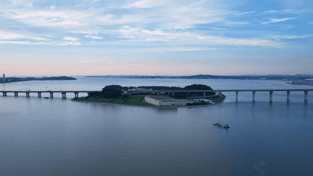Serene island with a bridge and sea