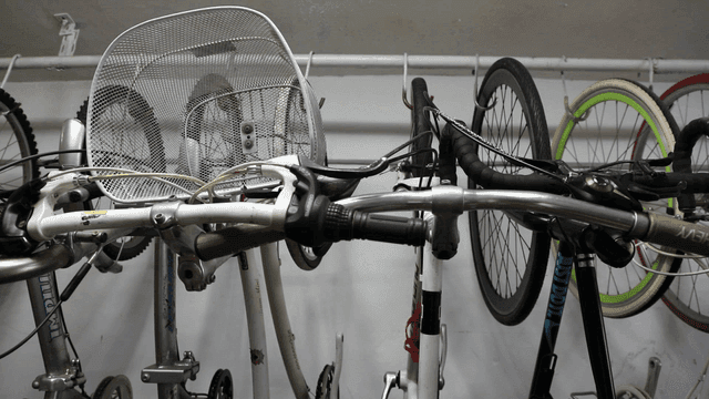 Bicycles hanging on a rack indoors