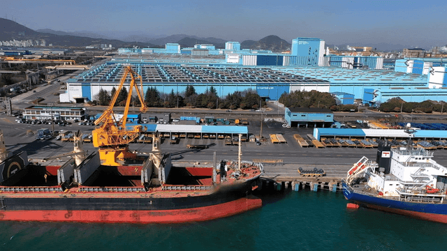Large cargo ship docked at an industrial port