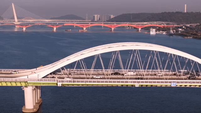 Bridge over a river with vehicles passing