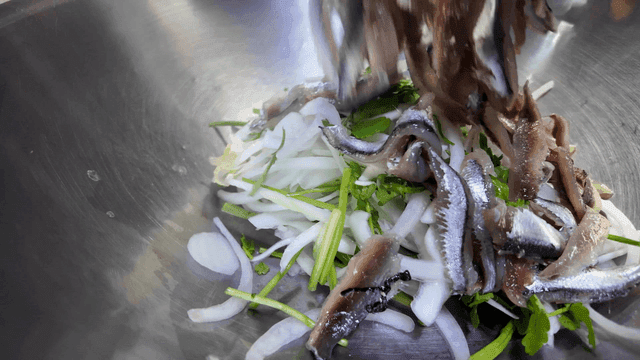 Fresh vegetables and anchovies in bowl