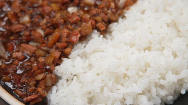 Appetizing black bean sauce with rice with minced meat and onions