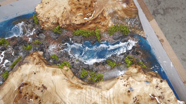Miniature river scene with rocks and plants
