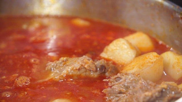 Pork backbone stew with pork backbones and potatoes