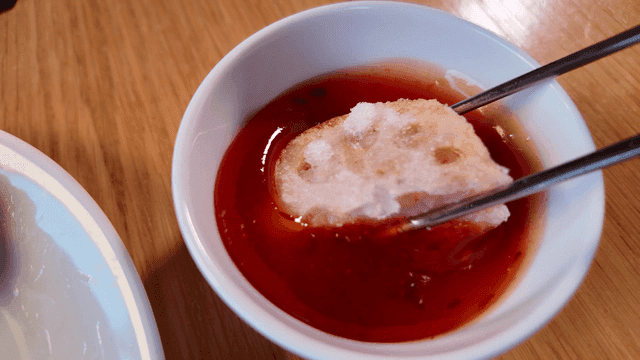 Fried lotus root dipped in chili sauce