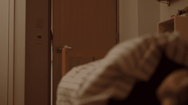 Mother checking on her sleeping child