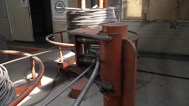 Metal wire being processed in a factory