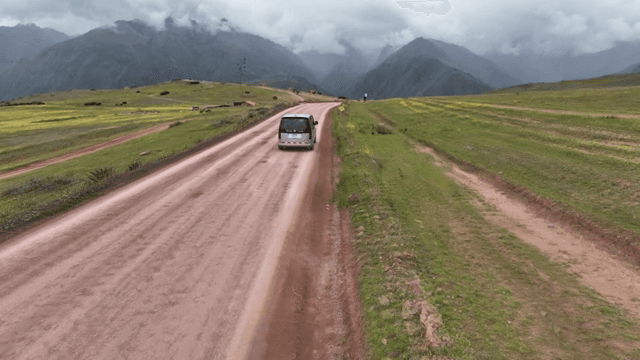 A van traveling on a rural mountain road