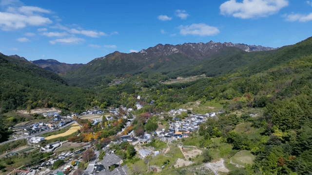 Green mountains under a clear sky