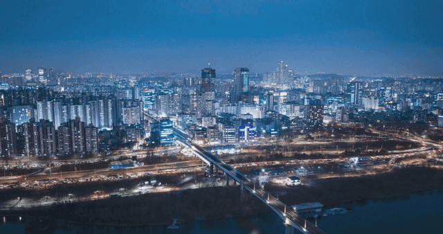 Bustling night city landscape with bright lights