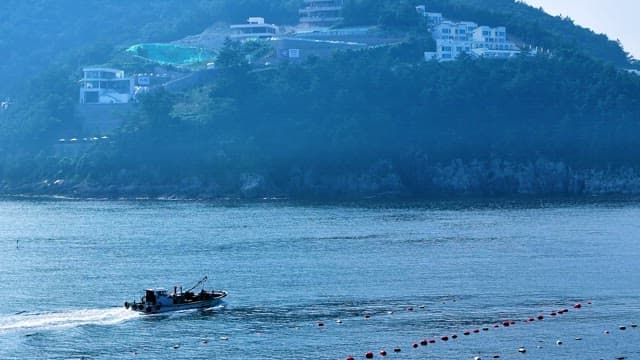 Fishing Boat Navigating Coastal Waters