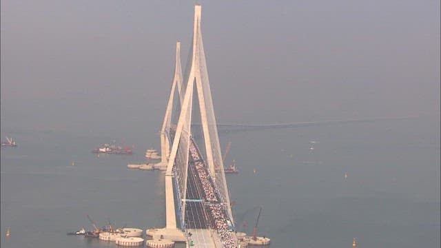 Incheon Bridge with marathon runners running