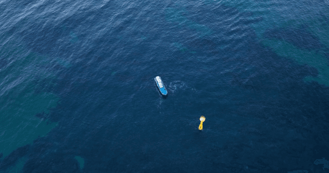 A boat navigating through clear blue waters