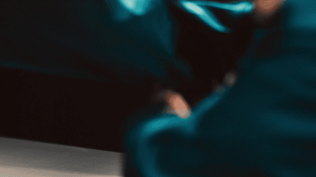 Prisoner stretches with his hands on floor and sits down.