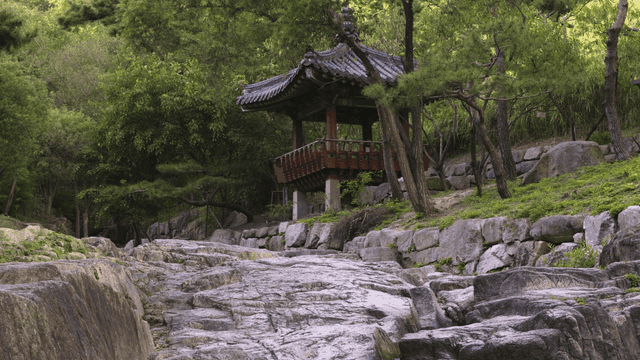 Traditional Korean pavilion in a forest