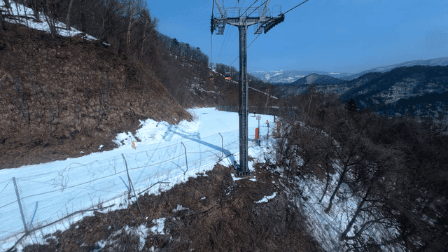 Skiers on a snowy mountain slope