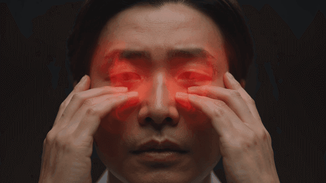Man massaging his face