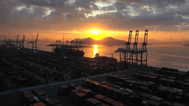 Sunset over a busy cargo port