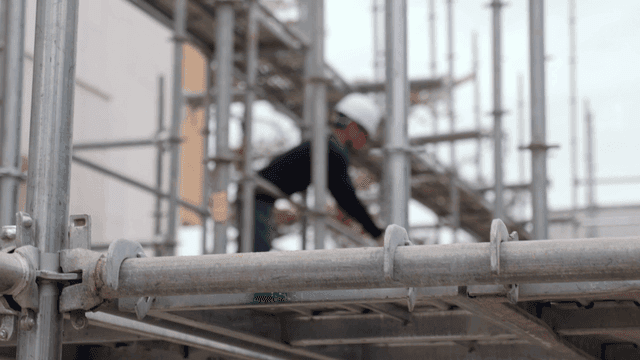 Construction workers on scaffolding