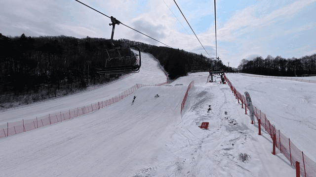 People boarding on snow-covered mountain slope