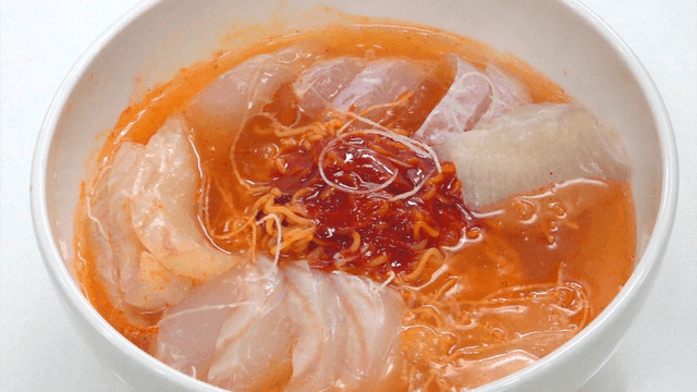 Mulhoe bibim-ramen topped with sashimi and soda