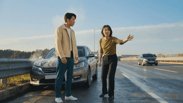 Man and woman seeking help after highway traffic accident