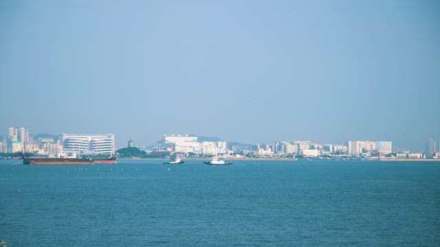 Seascape with a Large Ship and City in the Distance