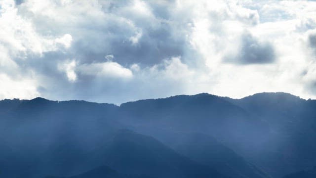 Cloudy sky over mountain peaks