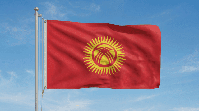 Red Kyrgyz flag with sun design