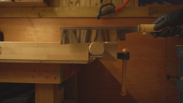 Wood being cut with a saw in a workshop