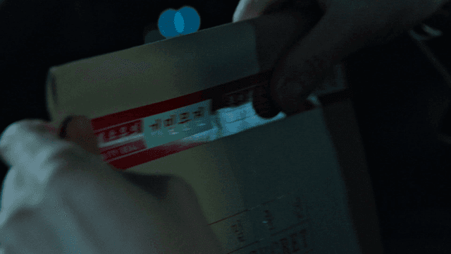 Sealing confidential document envelope at night