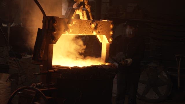 Molten metal being poured in a foundry