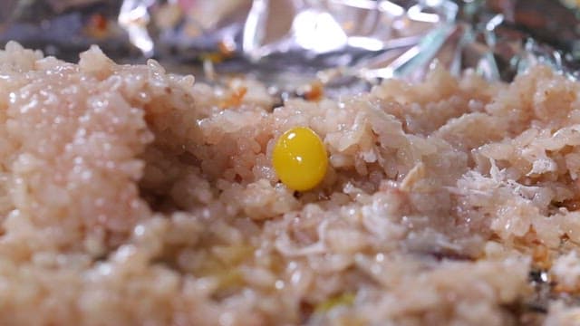 Nurungji made by pressing glutinous rice with a spoon on foil