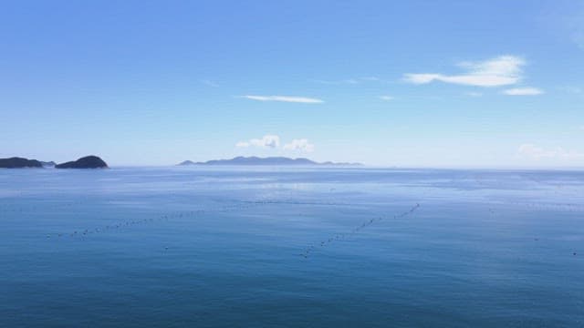 Calm sea with distant islands