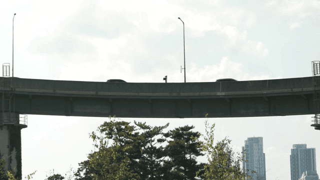 Vehicles driving on overpass