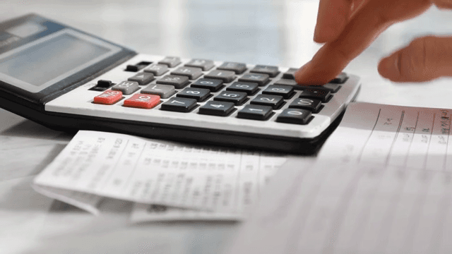 Calculating expenses with a calculator