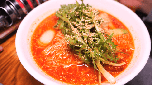 Spicy mixed noodles on table