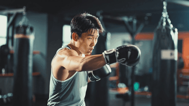 Man practicing boxing at gym