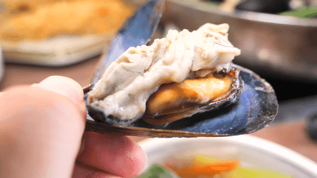 Chopsticks for holding mussels and oysters