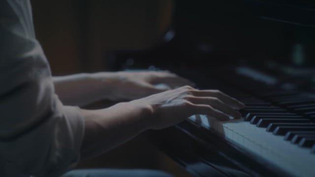 Close-up of person playing the piano