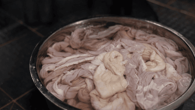 Pork intestines and small intestines soaked in water in kitchen