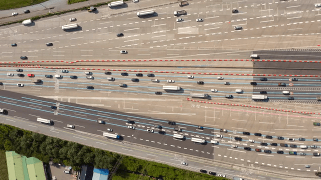 Busy highway with multiple lanes and vehicles