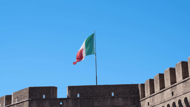 Historic fortress with Italian flag waving
