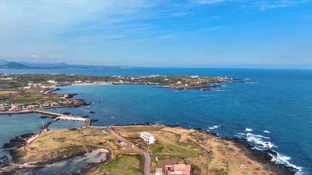 Coastal village with clear blue sea